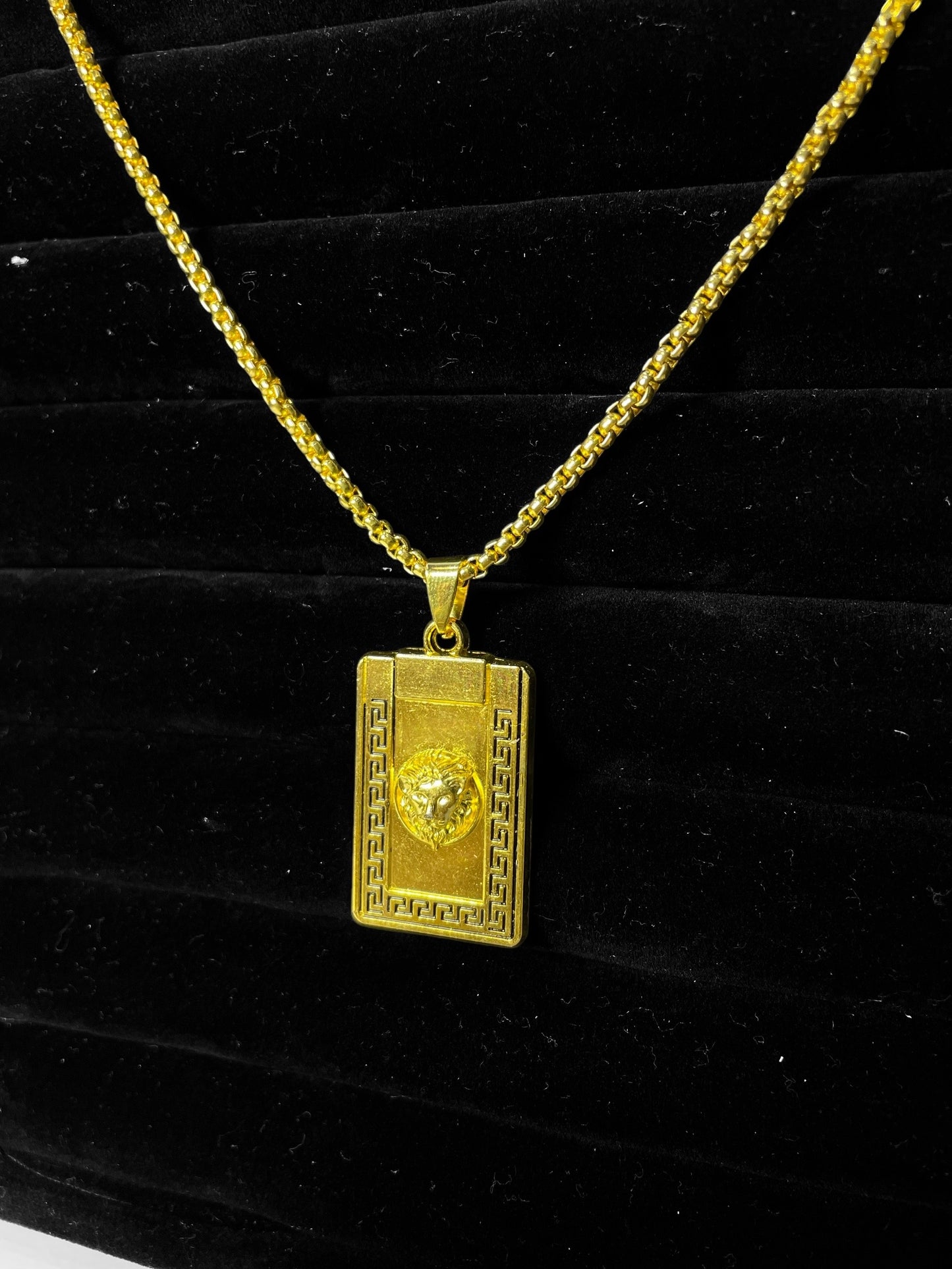 Gold medusa pendant